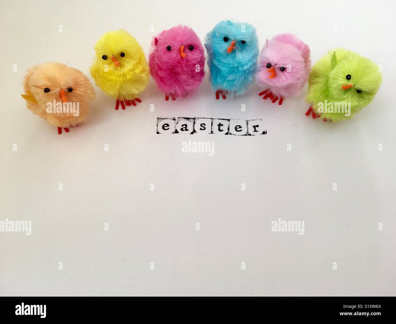 Colourful Easter chicks and the word Easter - Smartphone Captured Stock Image