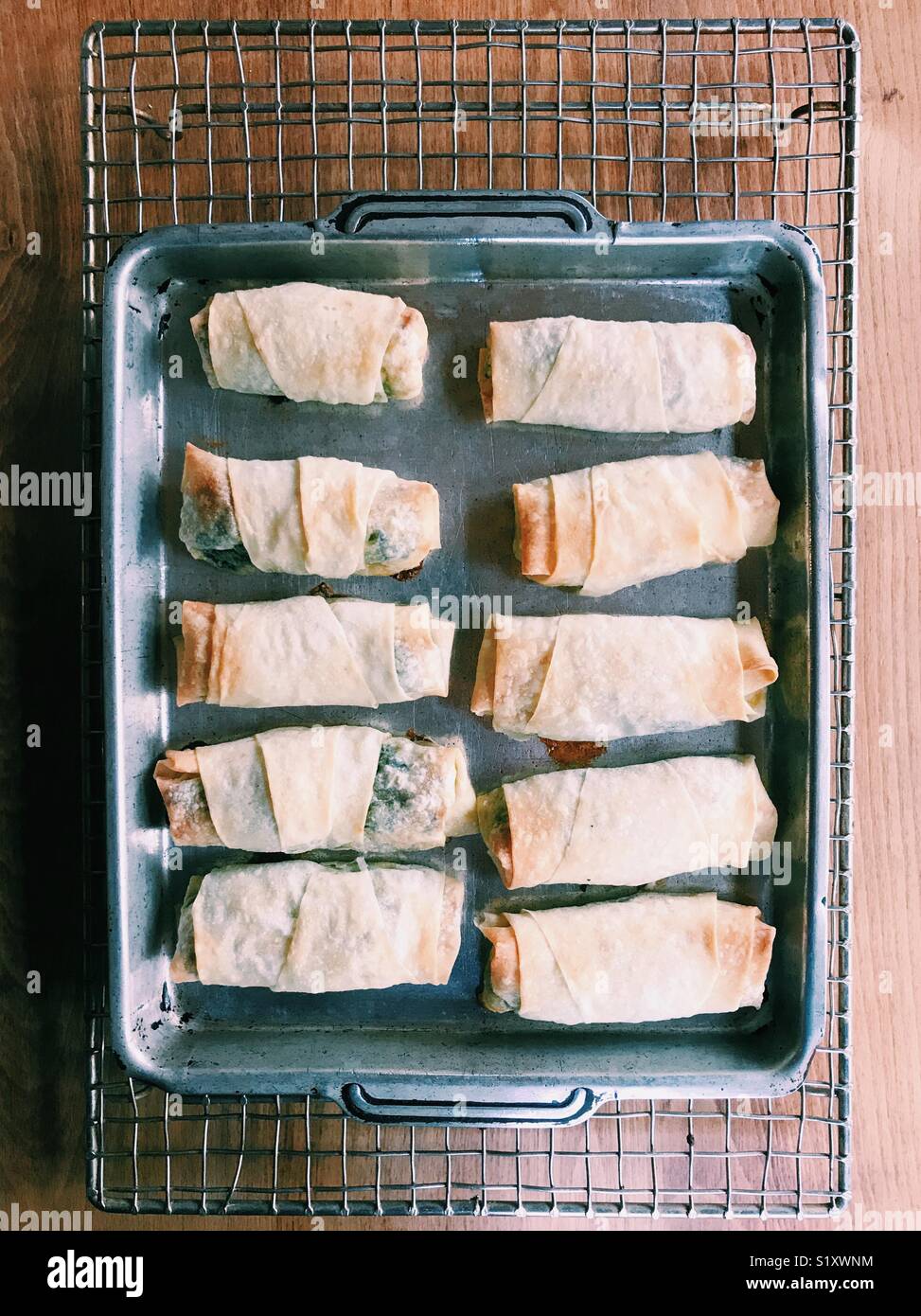 Baked spanakopitas, Greek spinach pies made with filo pastry. - Smartphone Captured Stock Image