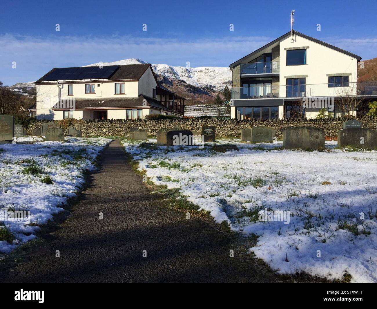 Cemetery in Coniston last resting place of Donald Campbell who set water speed record on Coniston Lake in 1967. The cemetery is overlooked by the Old Man of Coniston - Smartphone Captured Stock Image