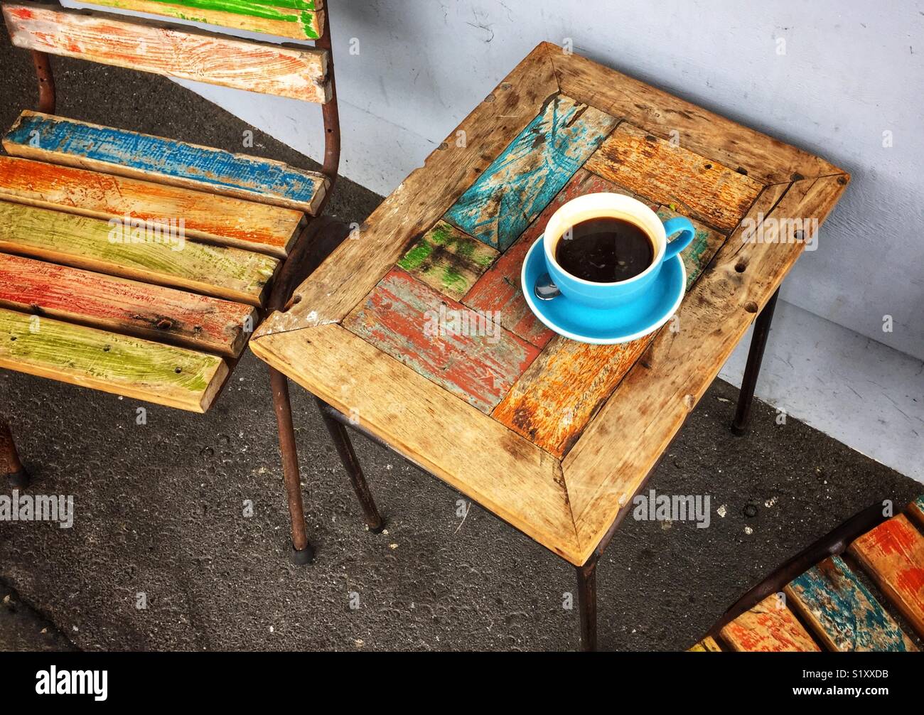 Coffee cup on colorful wooden table - Smartphone Captured Stock Image