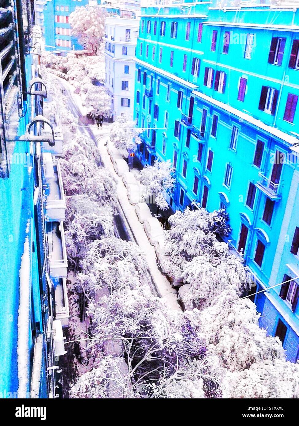Rare snowfall due to Arctic low pressure covers a street in the suburb of Policlinico, Rome, Italy. February 2018 - Smartphone Captured Stock Image