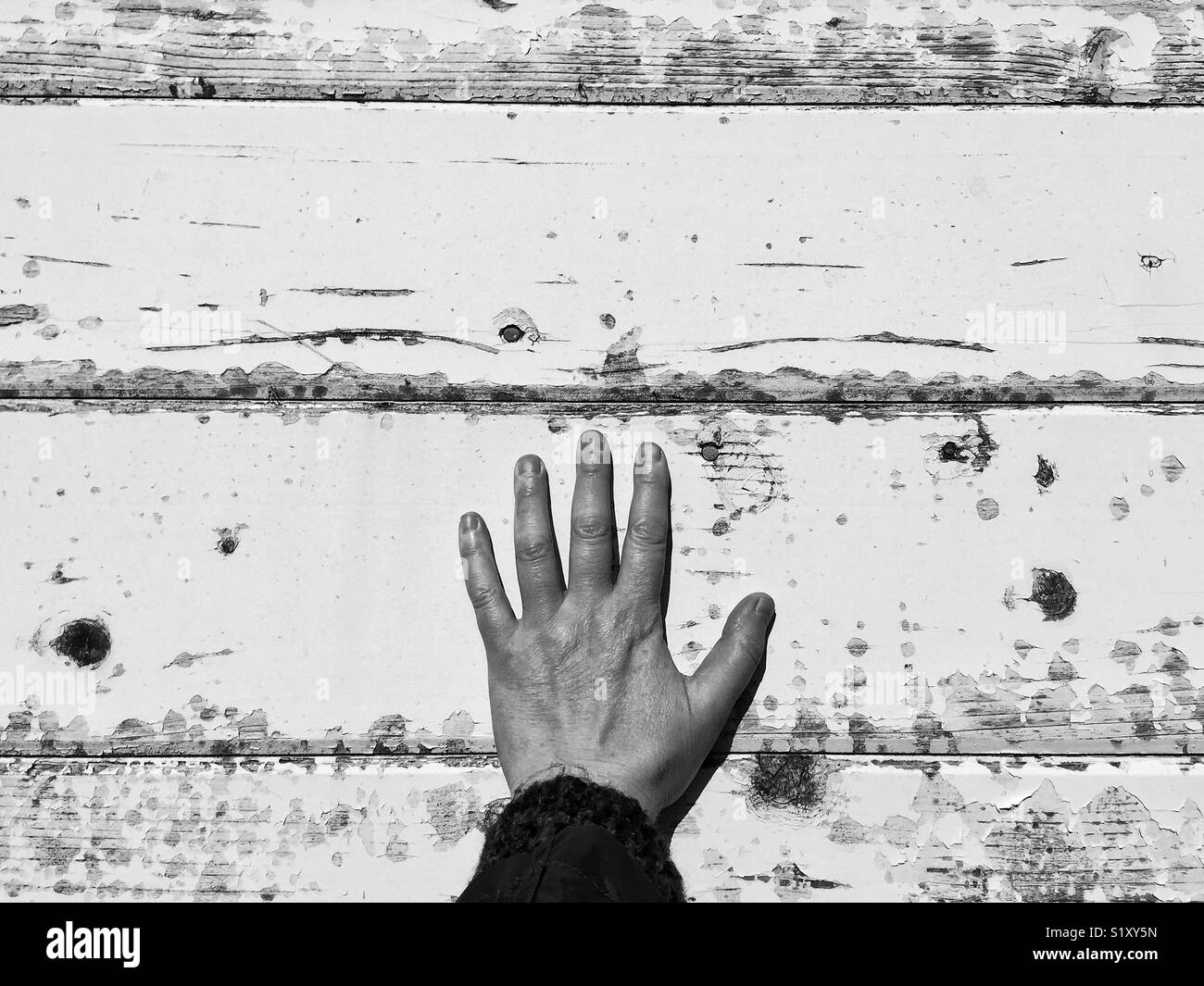 Touching the past. weathered white siding of West point lighthouse in Discovery Park in Seattle WASHINGTON - Smartphone Captured Stock Image