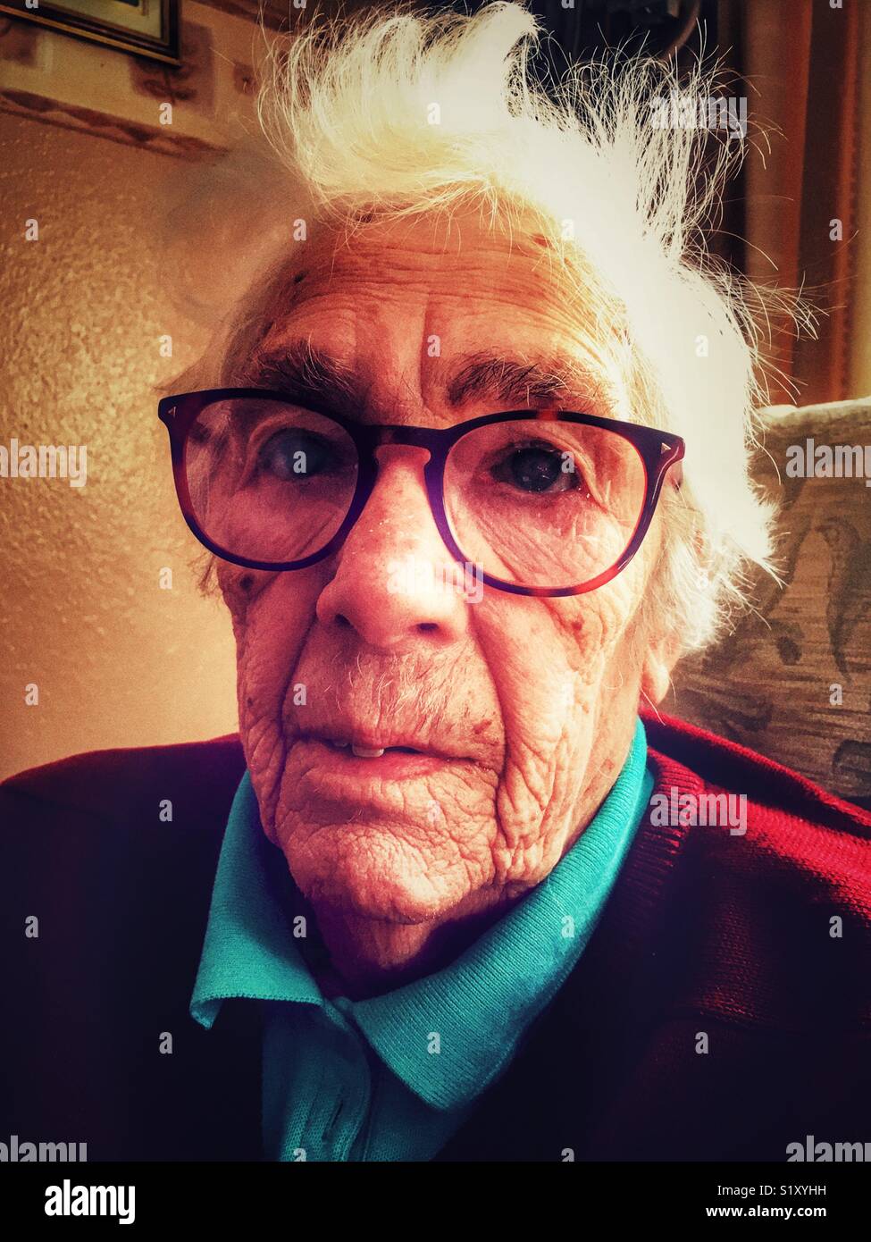 Elderly woman suffering from macular degeneration in her eyes. - Smartphone Captured Stock Image