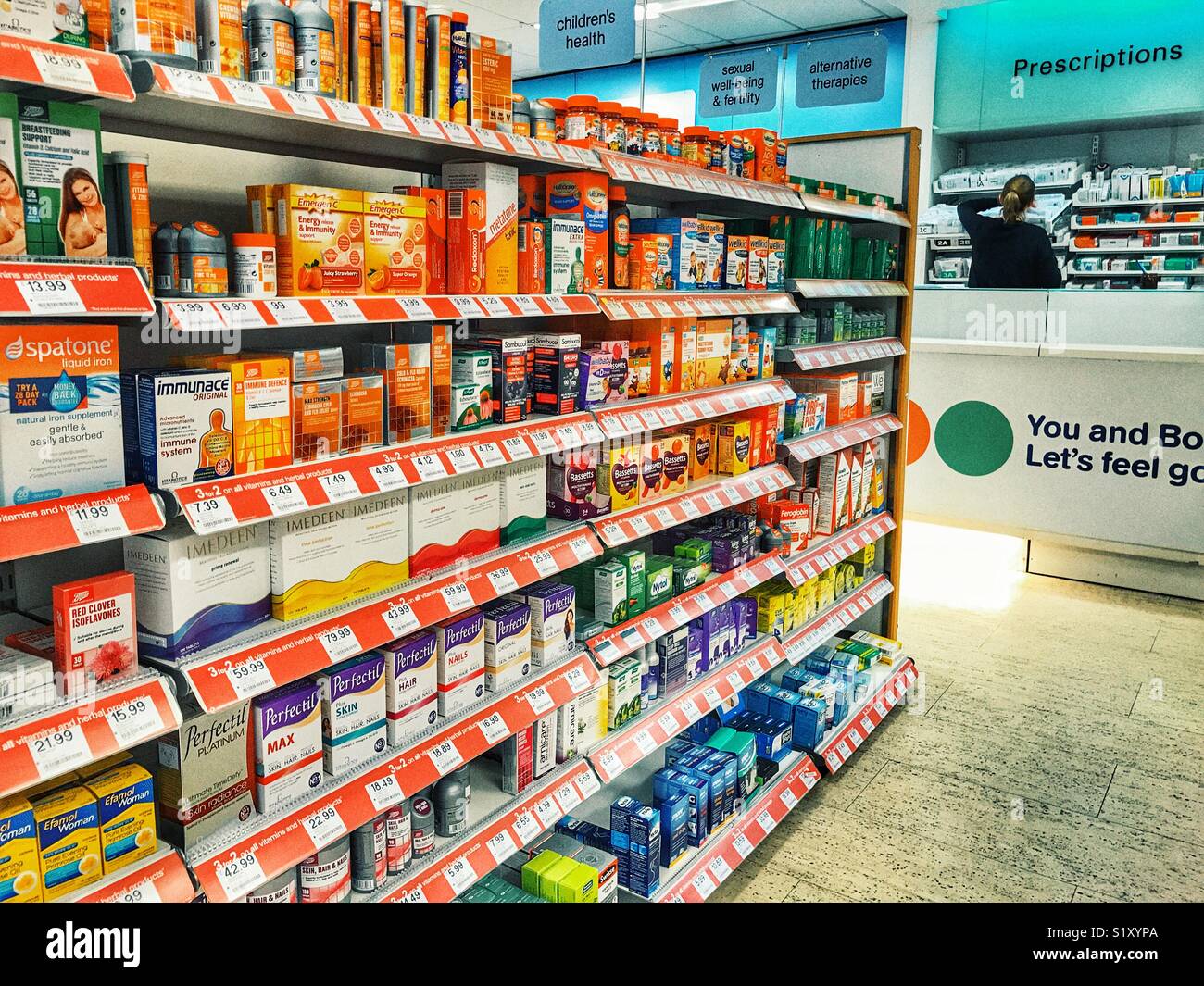 Boots the Chemist, interior, well stocked shelves with a variety of OTC  medications with a pharmacist behind the prescriptions counter Stock Photo  - Alamy