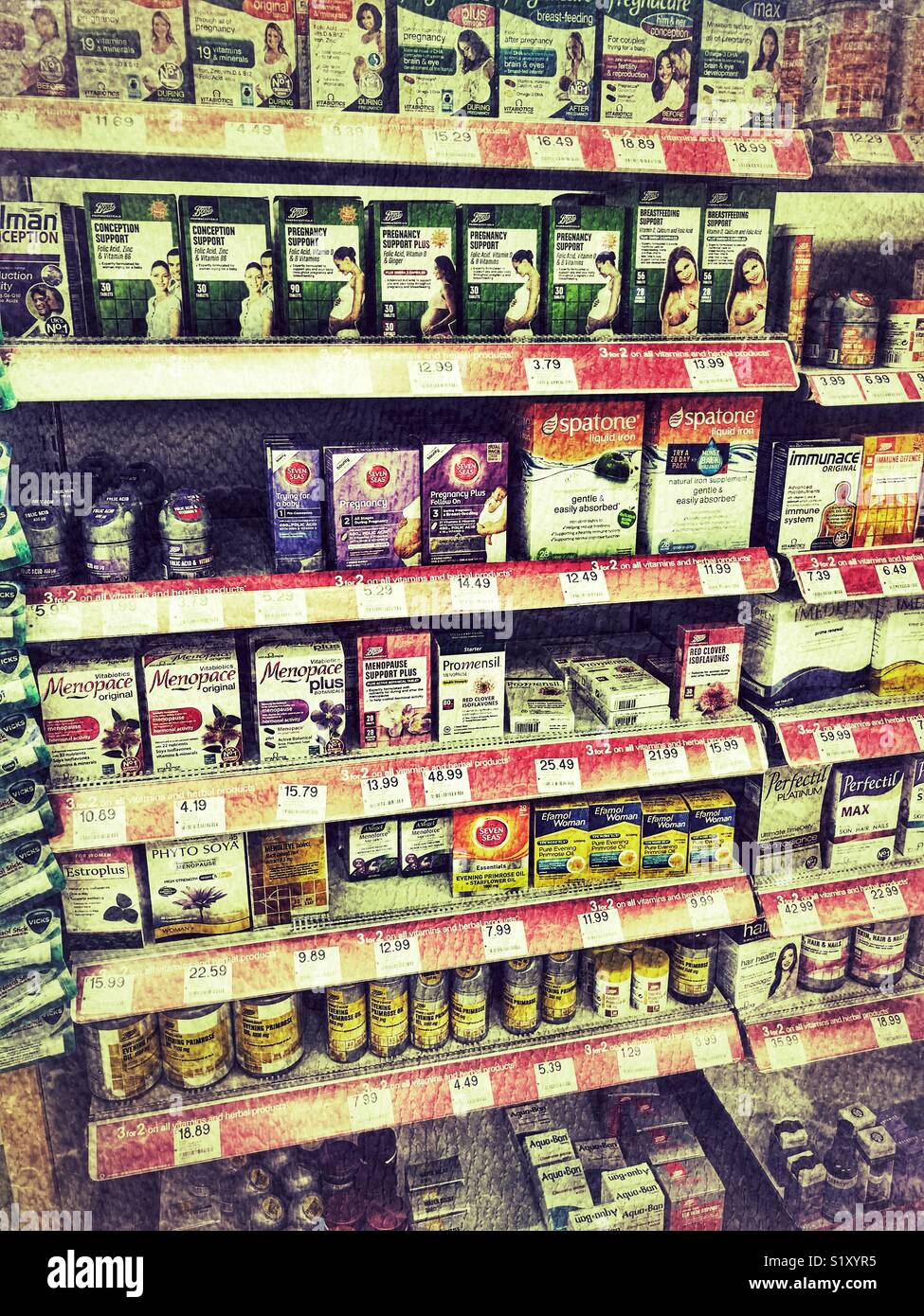 Boots the Chemist, interior, well stocked shelves with a variety of OTC medications - Smartphone Captured Stock Image