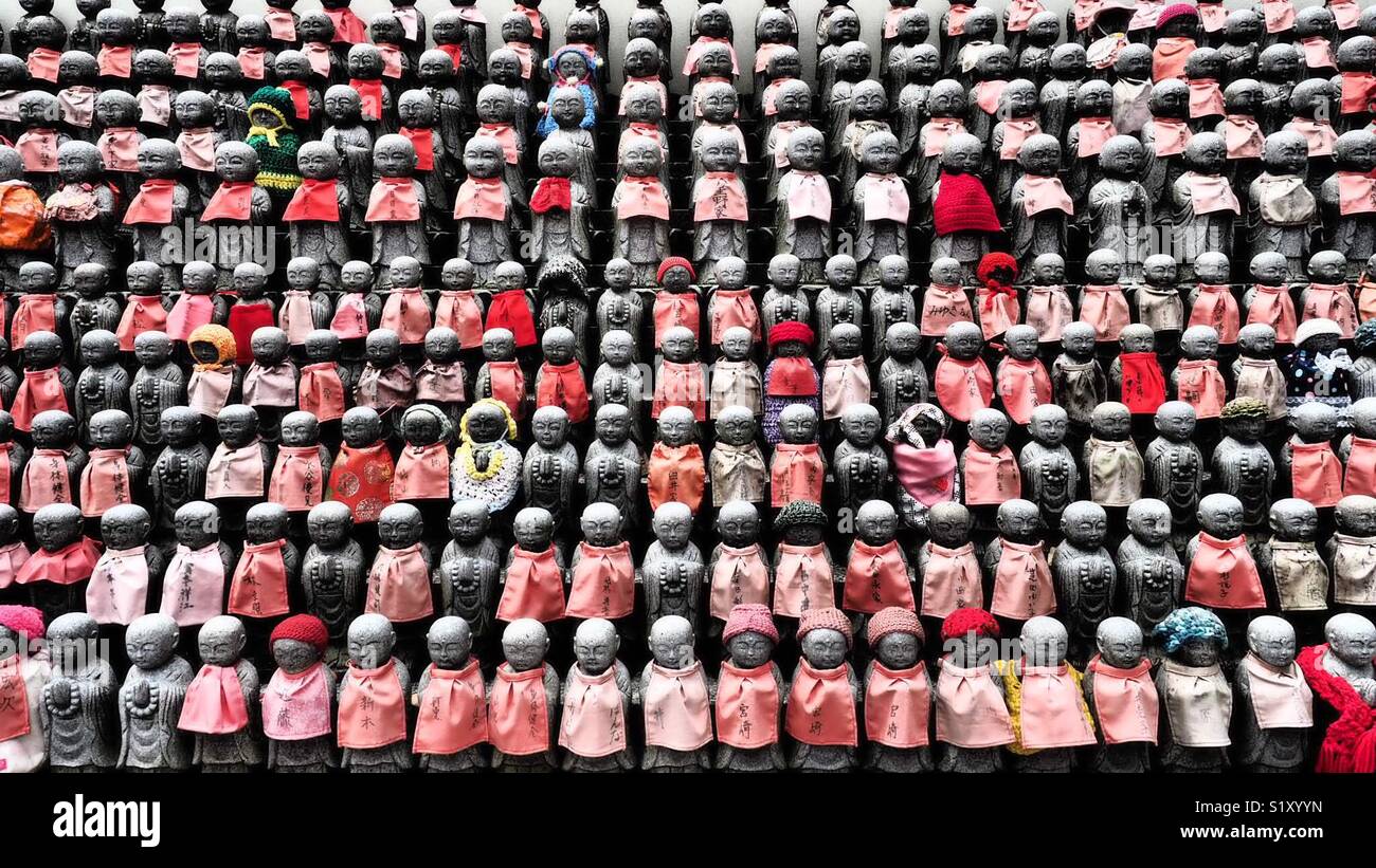 Buddha Statues Dressed in Red in Osaka Cemetery - Smartphone Captured Stock Image