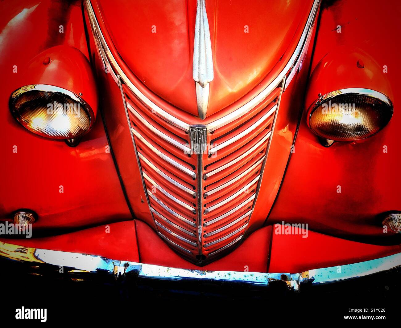 Vintage red Fiat van, viewed from above, showing front radiator grill in  chrome, headlamps mounted on wheel arches , chrome bumper and side lights  Stock Photo - Alamy
