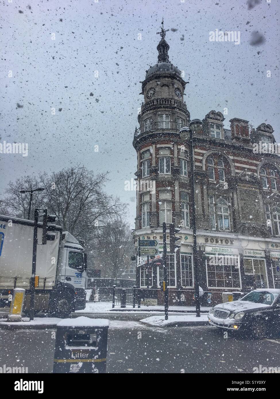 Beast from the East. Blizzard conditions on Junction Road, North London in February 2018. Street scene with the Boston Pub. - Smartphone Captured Stock Image