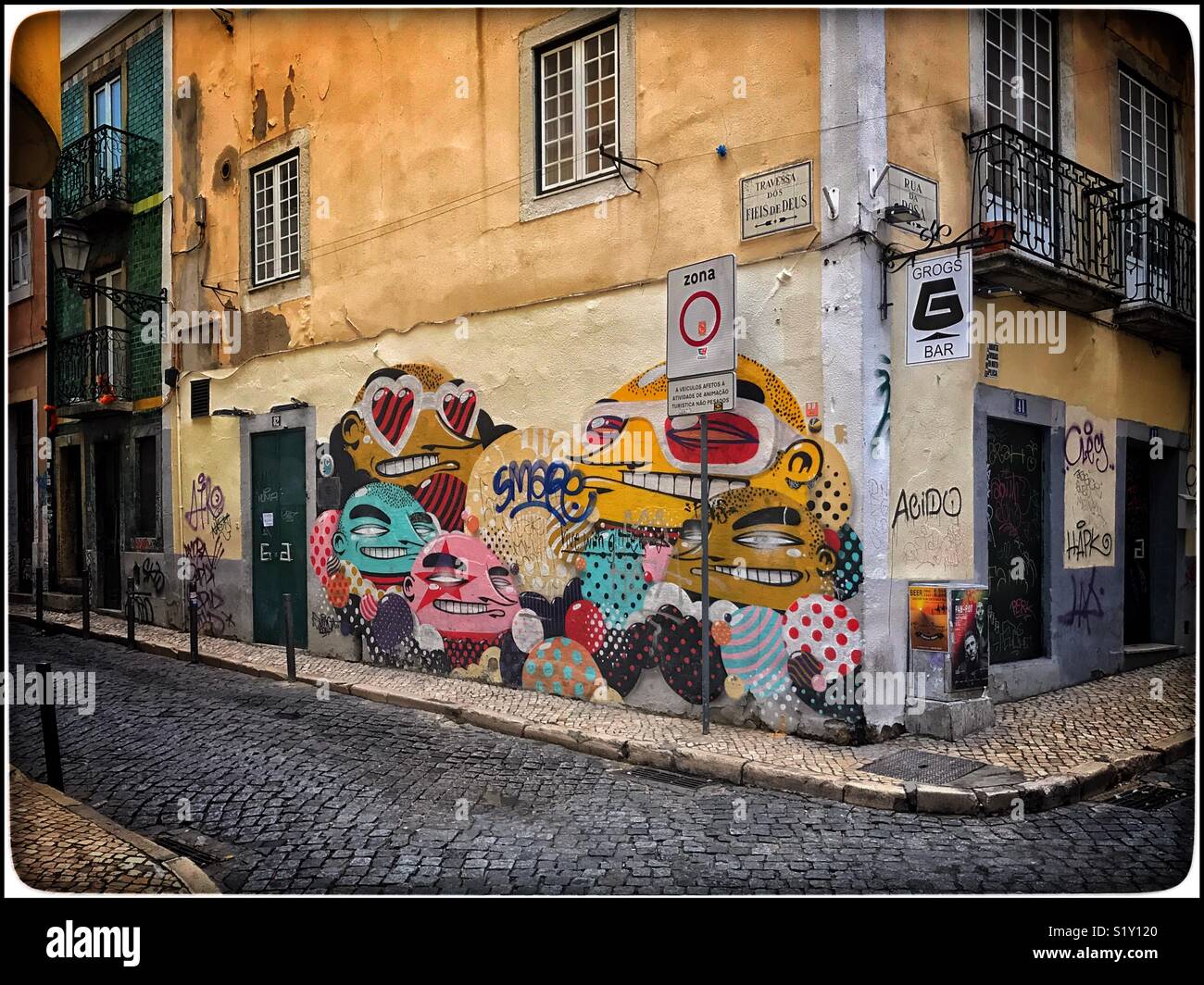 Graffiti Portraits (Creative Artwork) on the side of a building in the centre of Lisbon, Portugal. Photo Credit - © COLIN HOSKINS. - Smartphone Captured Stock Image