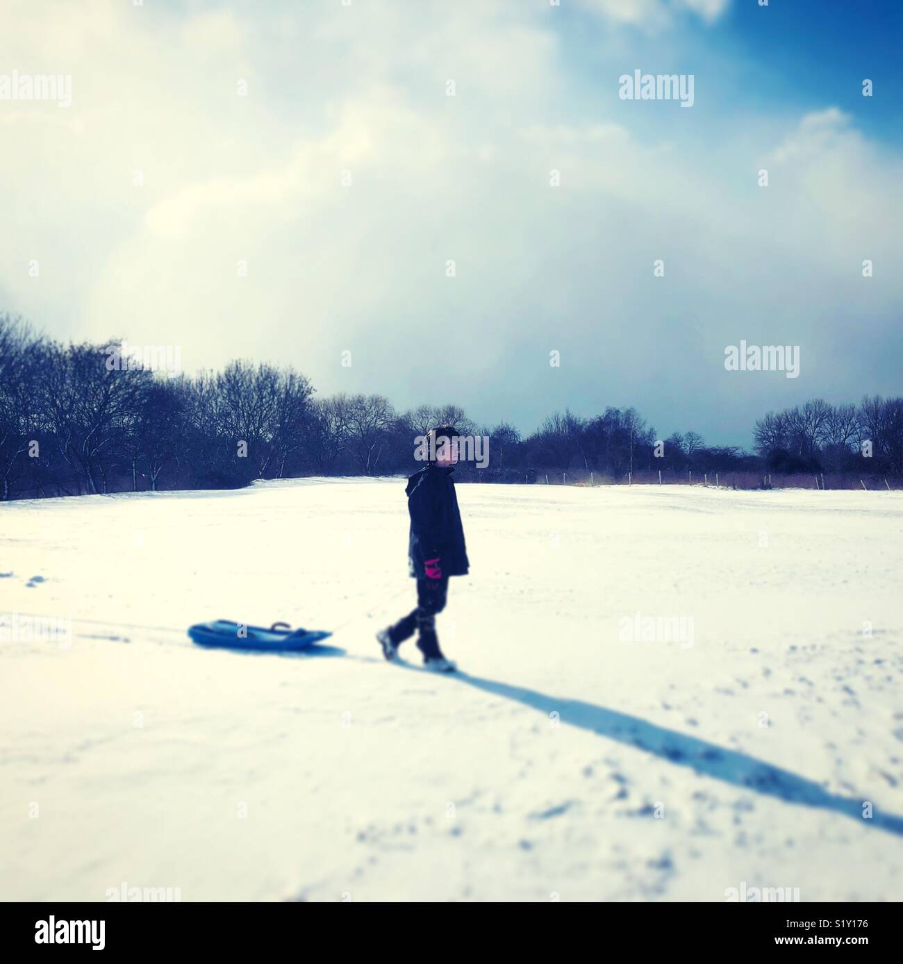 Snow scene London Ealing Boy with sledge Stock Photo
