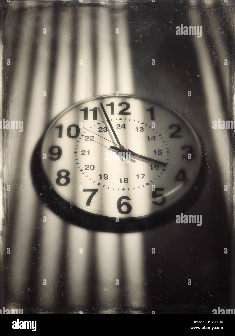 Institutional type clock on wall with shadows - Smartphone Captured Stock Image