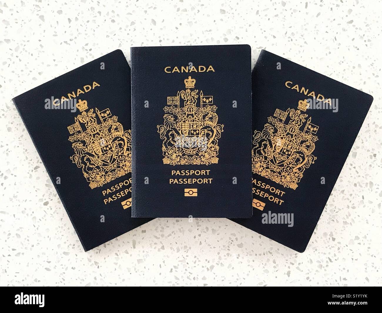 Three Canadian passports. - Smartphone Captured Stock Image