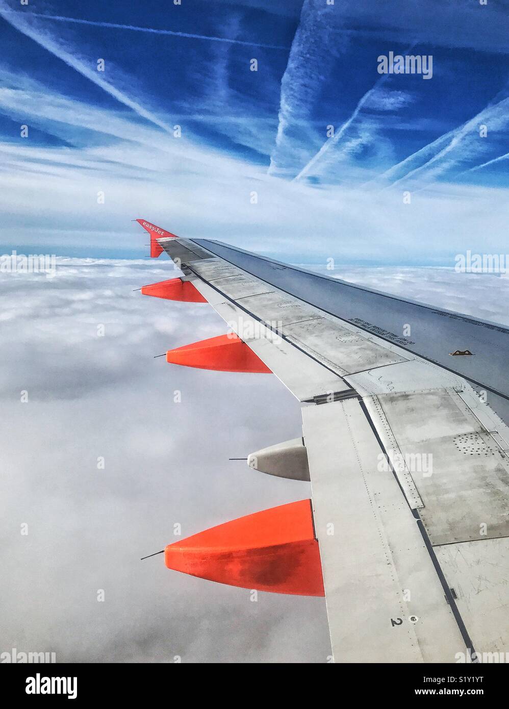 Above the clouds on an EasyJet Airbus aircraft, somewhere over Europe. Photo Credit - © COLIN HOSKINS. - Smartphone Captured Stock Image