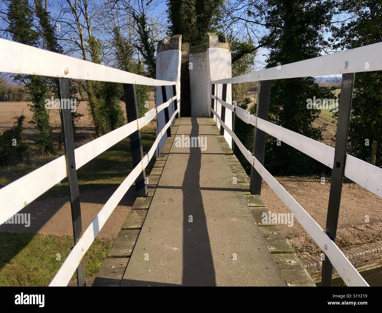 Architecturally quirky footbridge over a canal - Smartphone Captured Stock Image