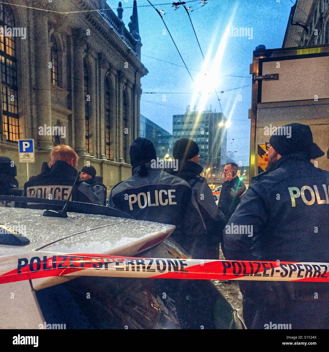 Police officers behind a cordon, Bern, Switzerland - Smartphone Captured Stock Image