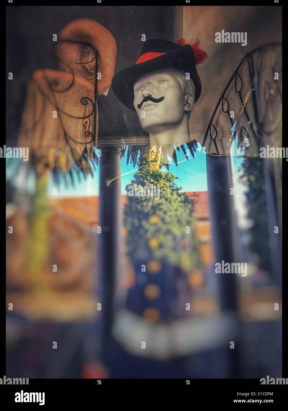 Display in antique store window with reflection. - Smartphone Captured Stock Image