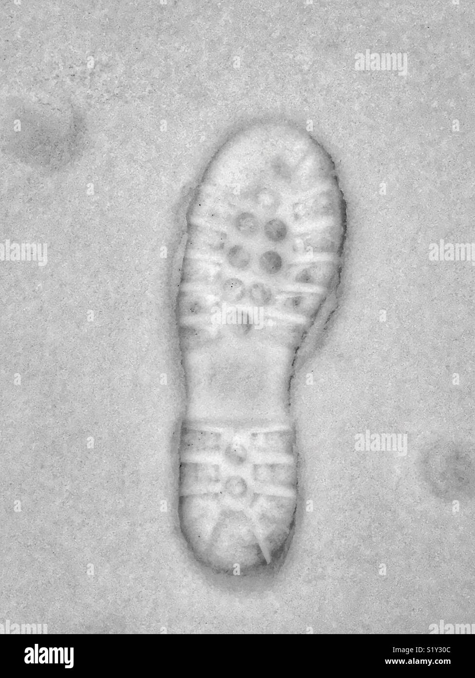 Left foot. Walking boot imprint in the snow. This person walked forward. Photo Credit - © COLIN HOSKINS. - Smartphone Captured Stock Image
