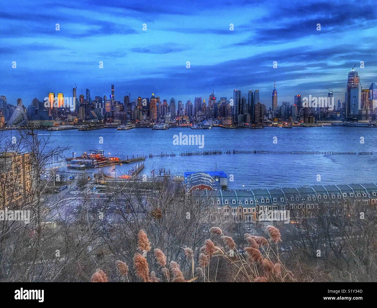 New York City sunset blue sky Stock Photo - Alamy