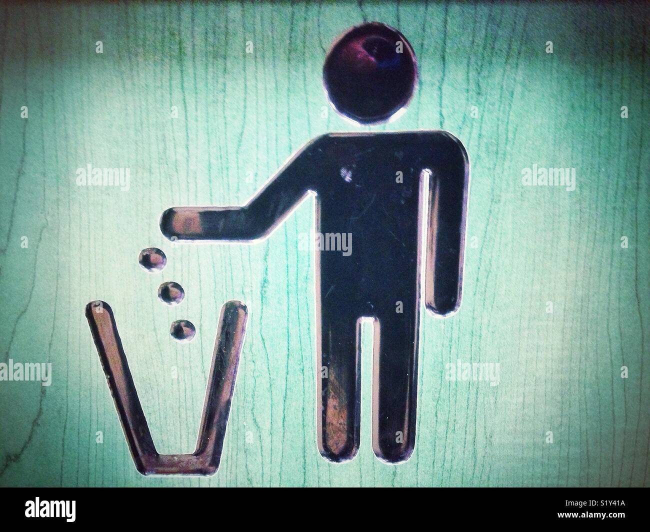 A litter symbol on a rubbish bin. - Smartphone Captured Stock Image