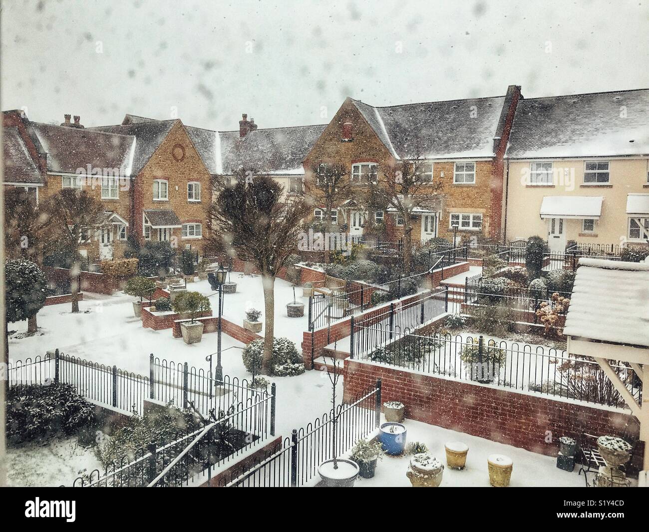 Residential area in snow during a blizzard, March 2018, Storm Emma in Sherborne, Dorset, England - Smartphone Captured Stock Image