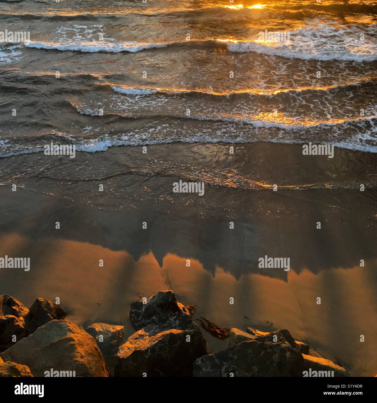 Sunset waves on Pacific shoreline, California, USA - Smartphone Captured Stock Image