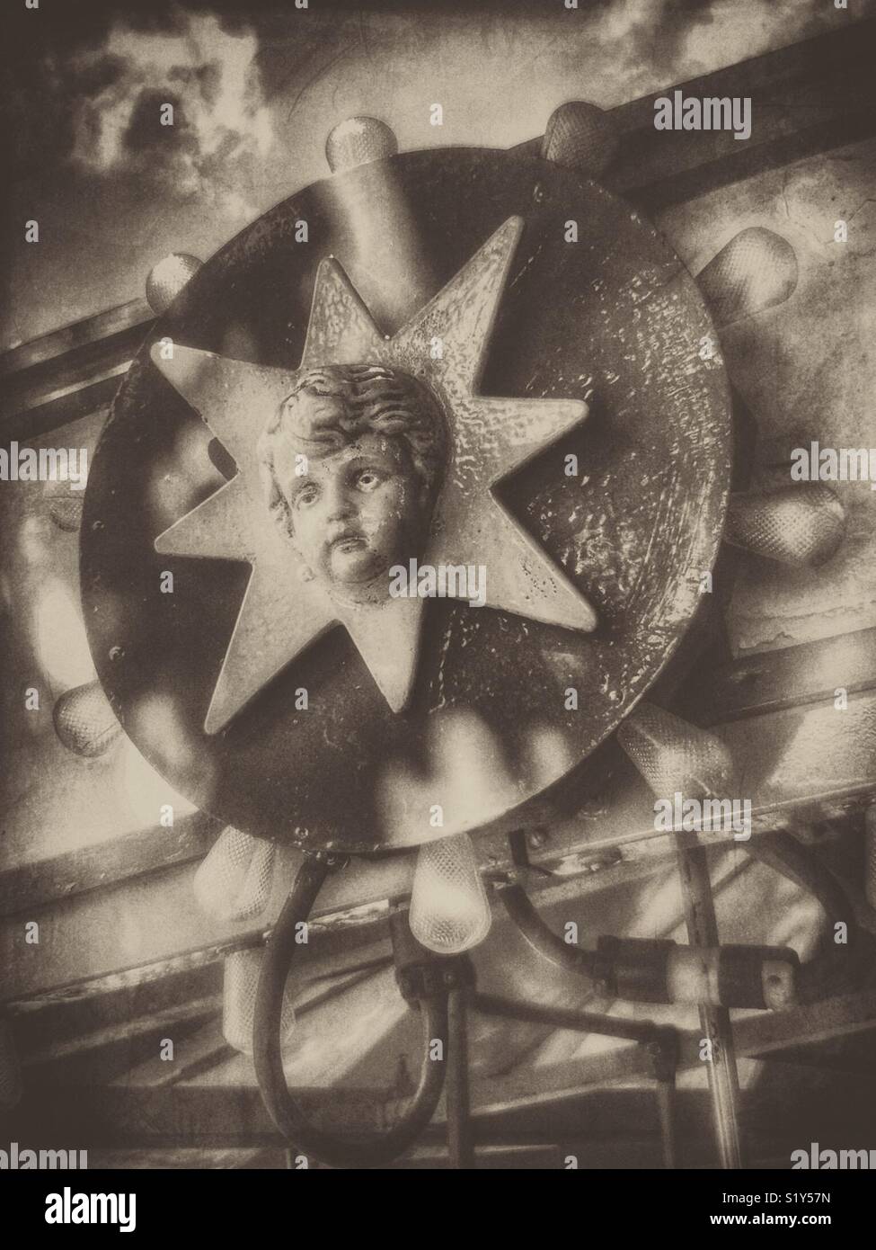 Cherubic face on kiddie carousel - Smartphone Captured Stock Image