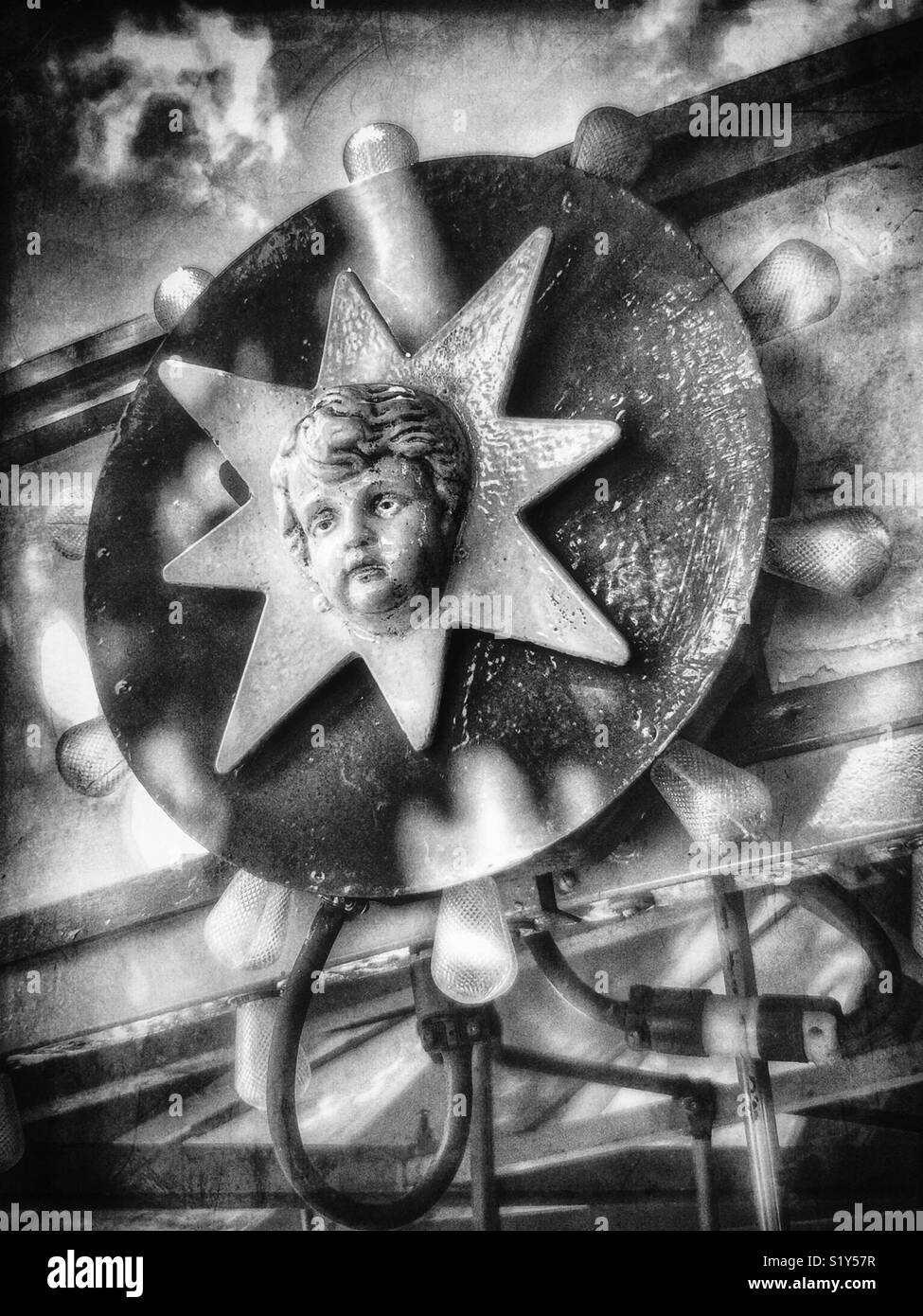 Cherubic face on kiddie carousel - Smartphone Captured Stock Image