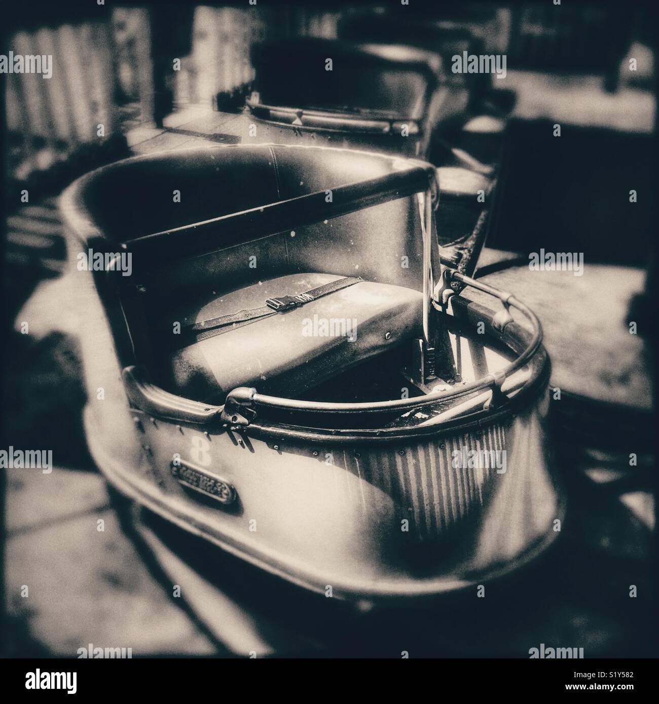 Moody sepia kiddie ride - Smartphone Captured Stock Image