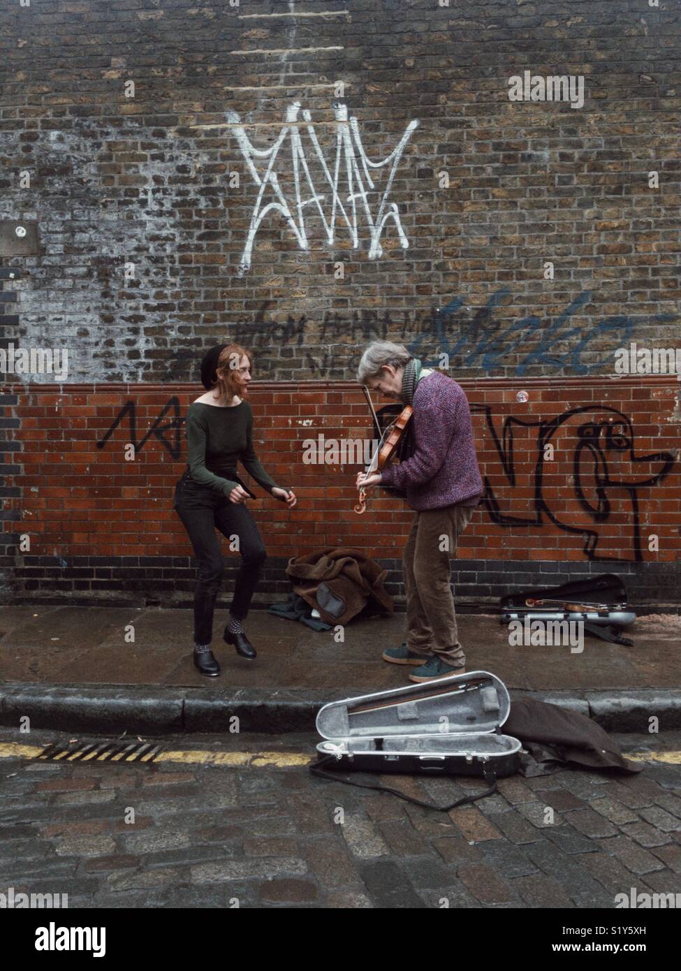 Street musicians performing at Columbia flower market in east London - Smartphone Captured Stock Image