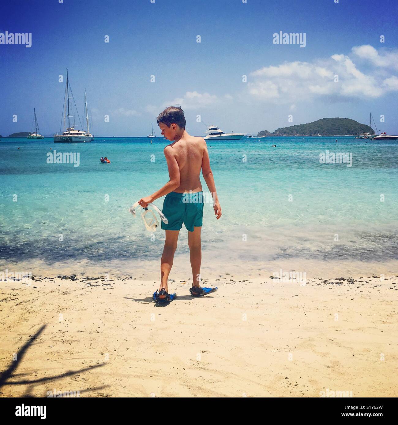 Child going snorkelling at St John island Stock Photo