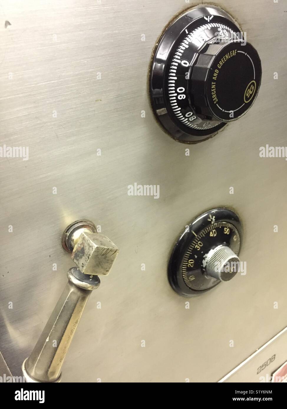 Face of a safe with a dial combination lock in a financial institution, USA - Smartphone Captured Stock Image