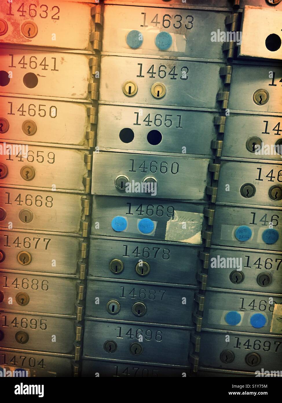 Safe deposit boxes in secure room vault in financial institution, United States - Smartphone Captured Stock Image