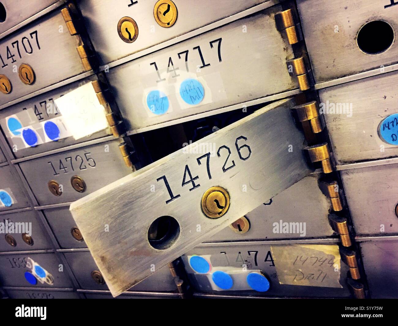 And open safe deposit box in secure vault area in a bank, USA - Smartphone Captured Stock Image