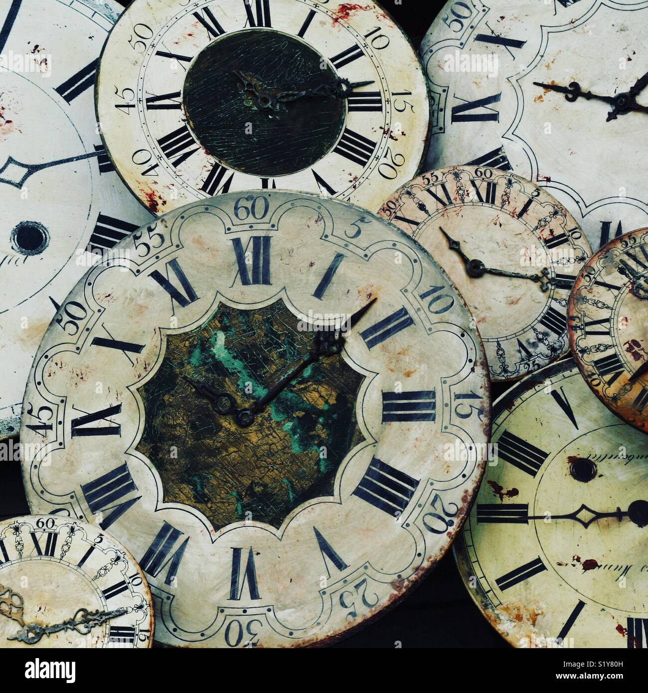 A collection of antique clock faces - Smartphone Captured Stock Image