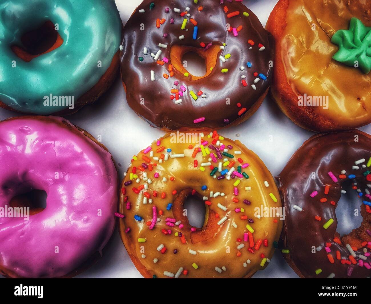 Overhead shot of a brightly colored assortment of donuts - Smartphone Captured Stock Image