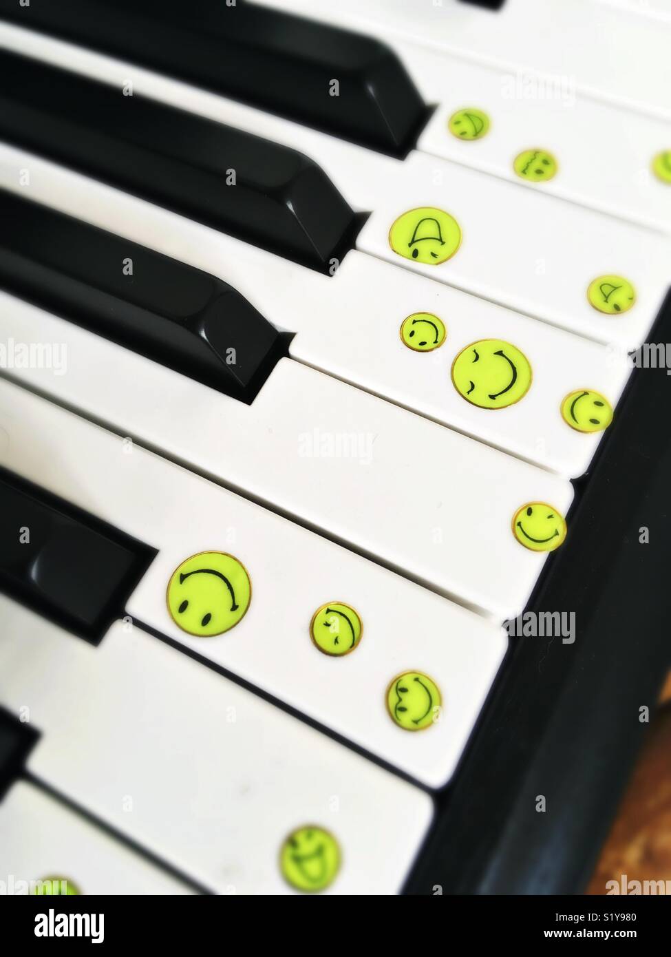 Piano keys with smiley faces Stock Photo - Alamy