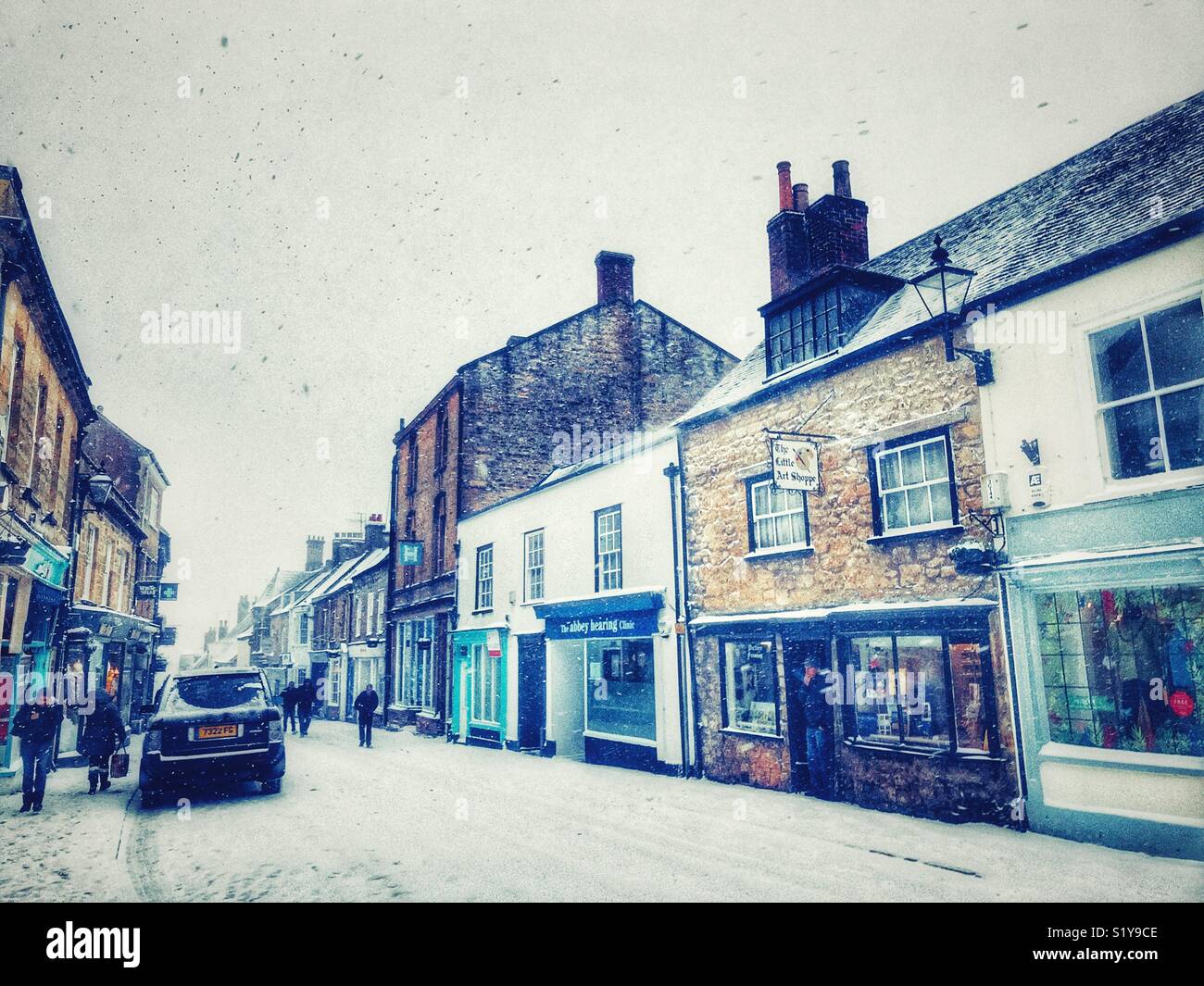 Cheap Street and winter  townscape with heavy snowfall in Sherborne, Dorset, England during the blizzard of Storm Emma, March 2018 - Smartphone Captured Stock Image