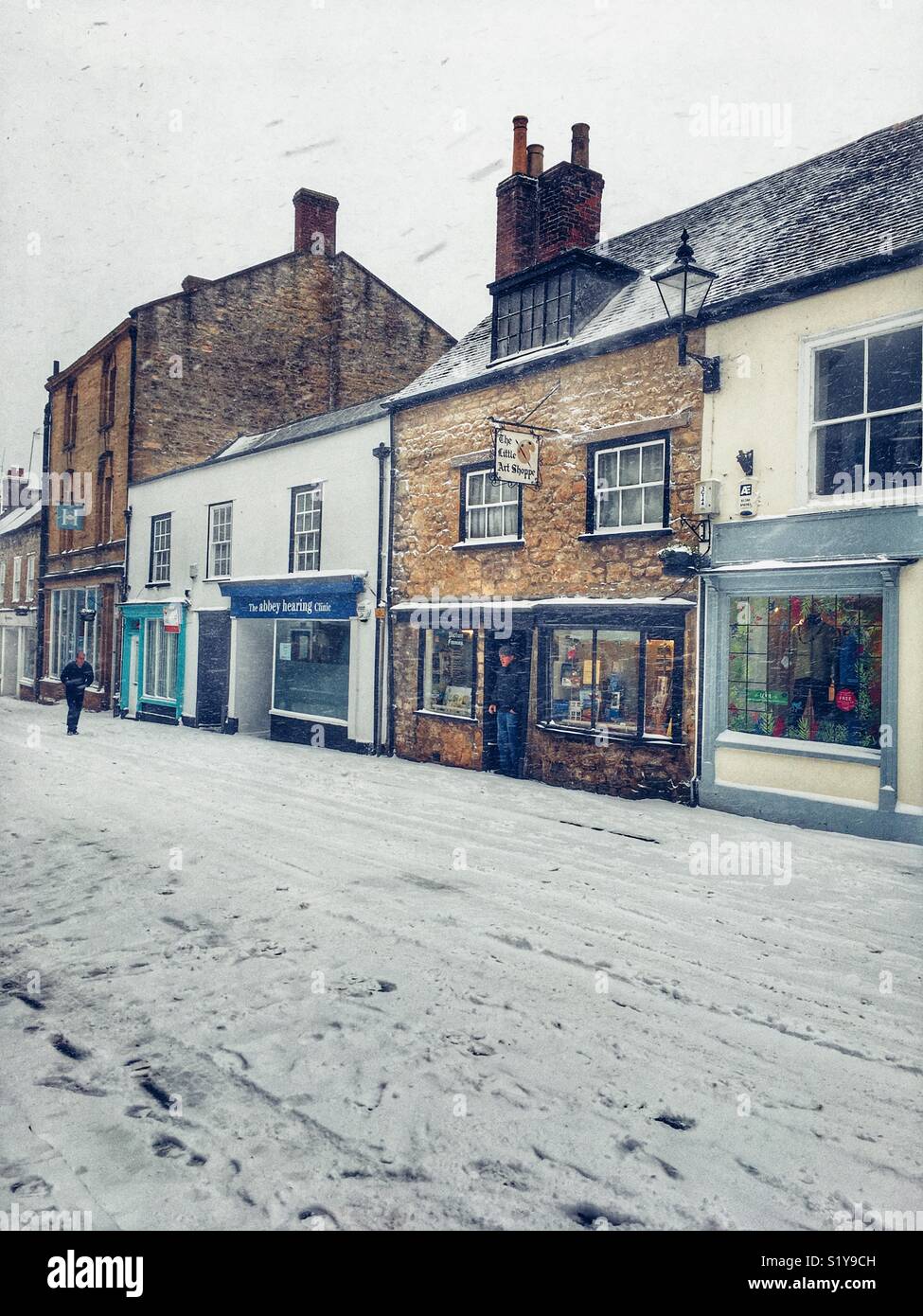 Cheap Street and winter  townscape with heavy snowfall in Sherborne, Dorset, England during the blizzard of Storm Emma, March 2018 - Smartphone Captured Stock Image