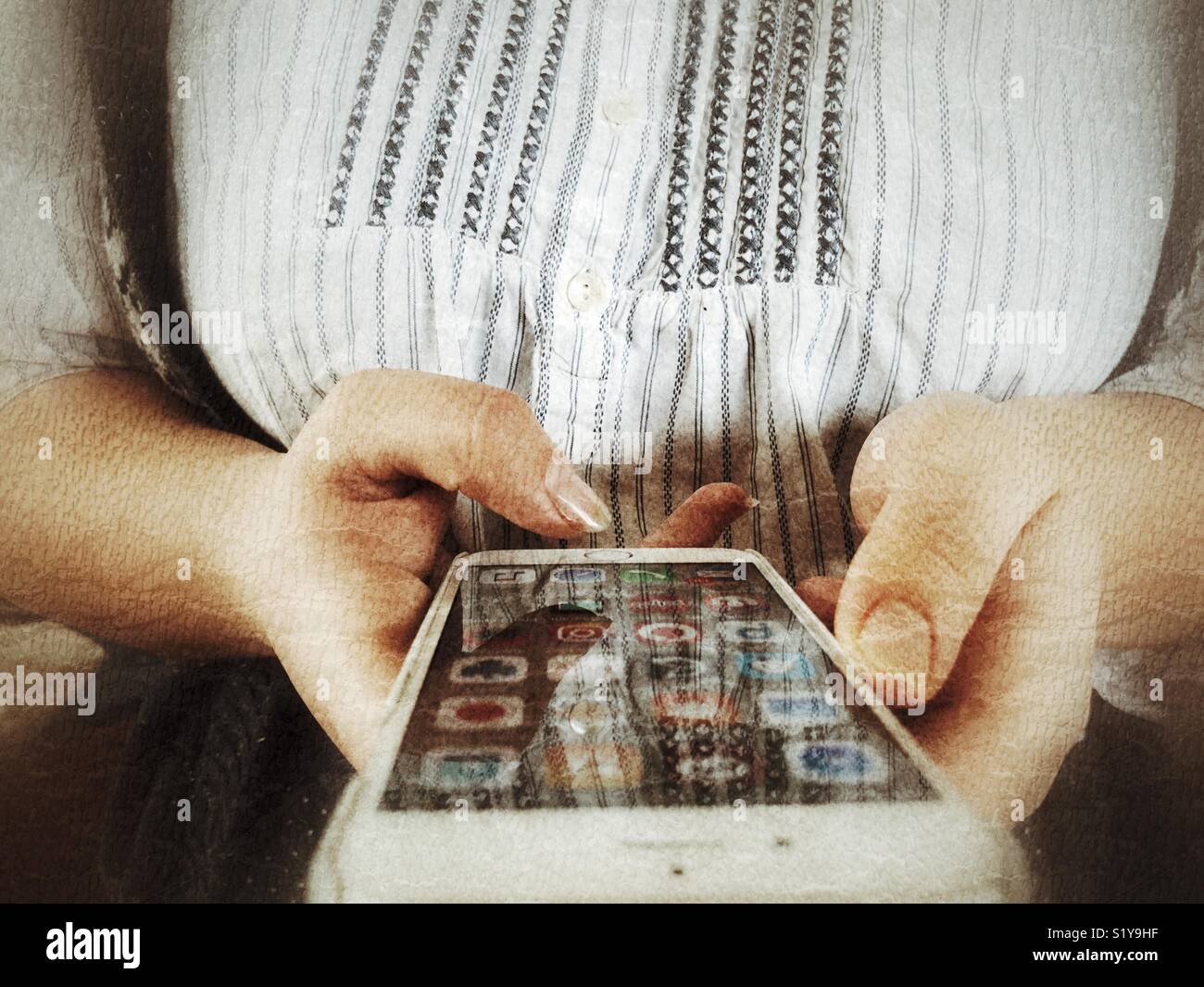 Millennial woman using iPhone - Smartphone Captured Stock Image
