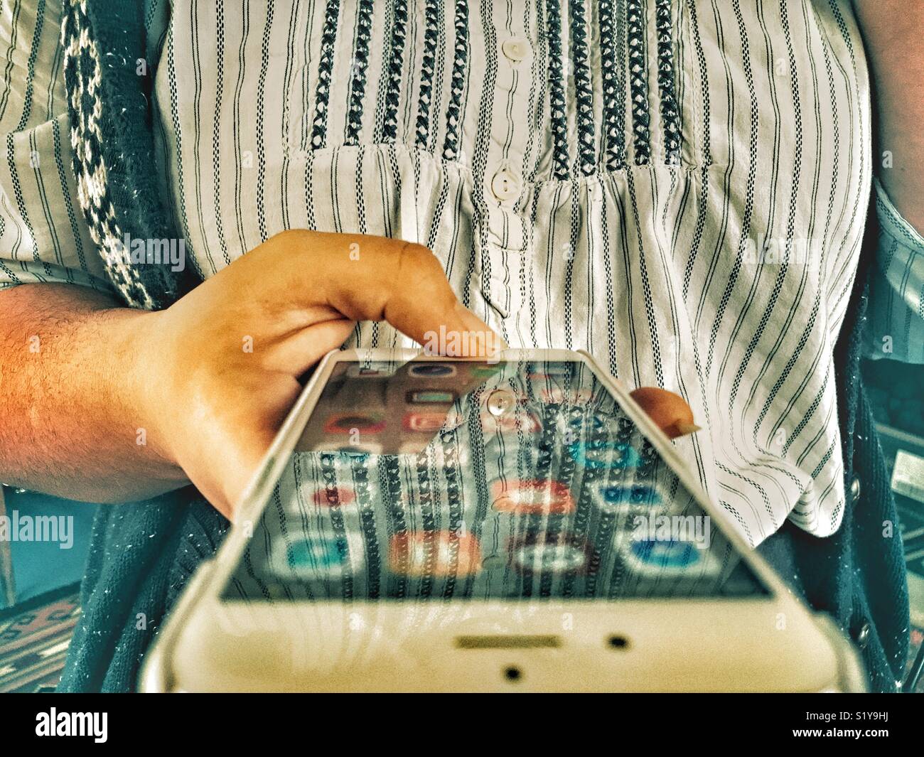 Millennial woman using technology - Smartphone Captured Stock Image