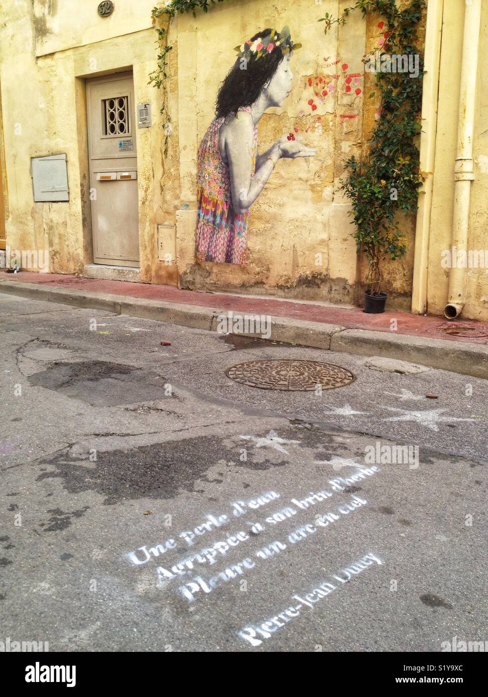 Graffiti and poetic sentence in a street, Montpellier France Stock