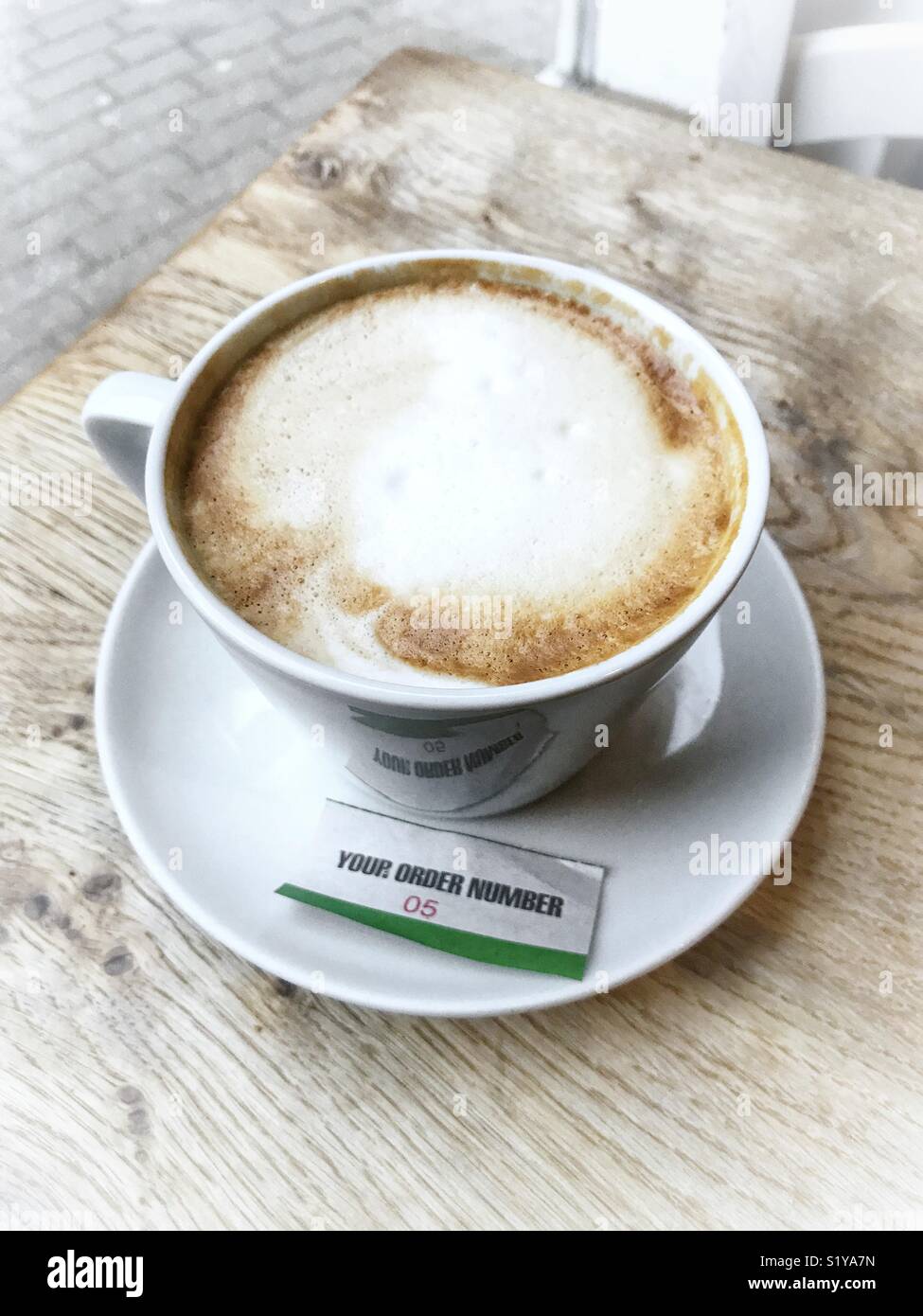 Cup of coffee with order slip - Smartphone Captured Stock Image