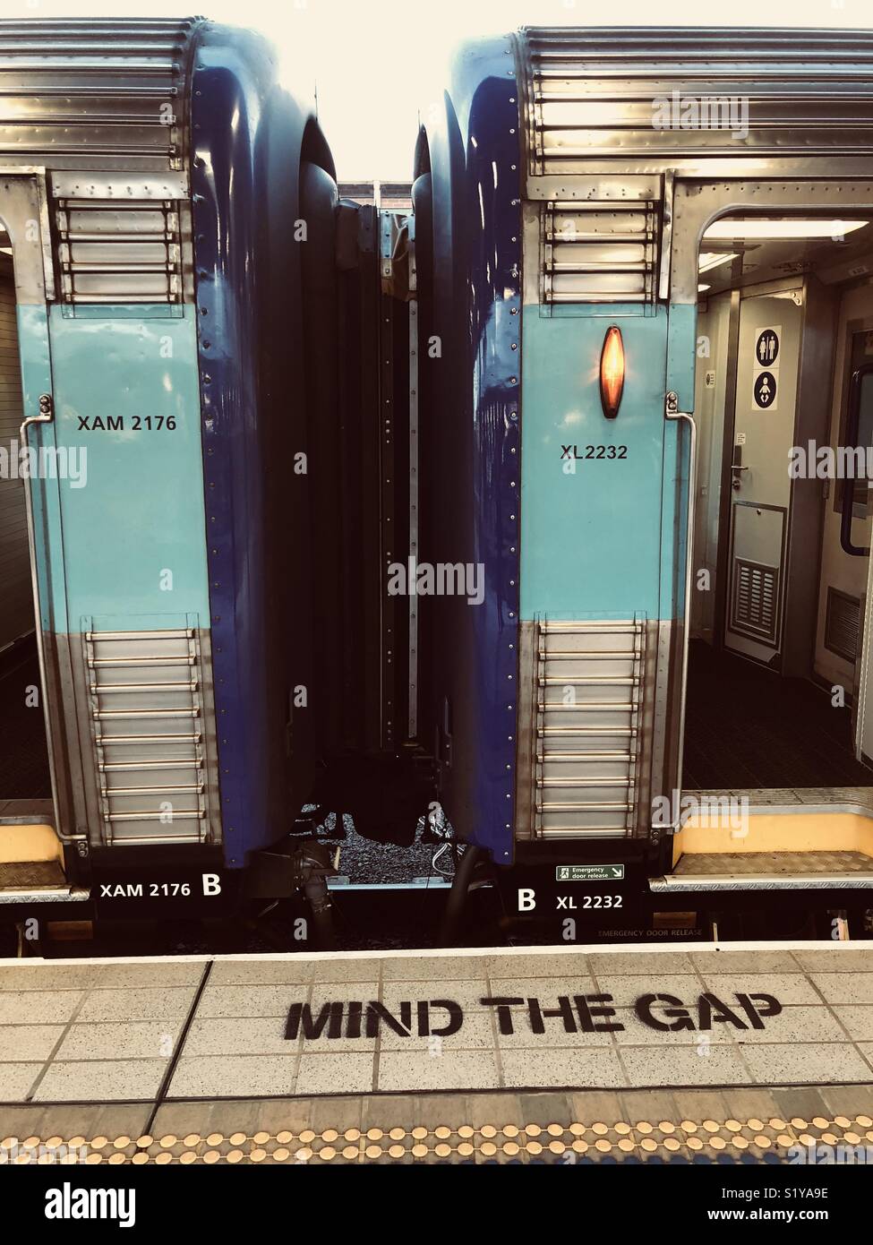Sydney train station with mind the gap sign and the train to Melbourne - Smartphone Captured Stock Image