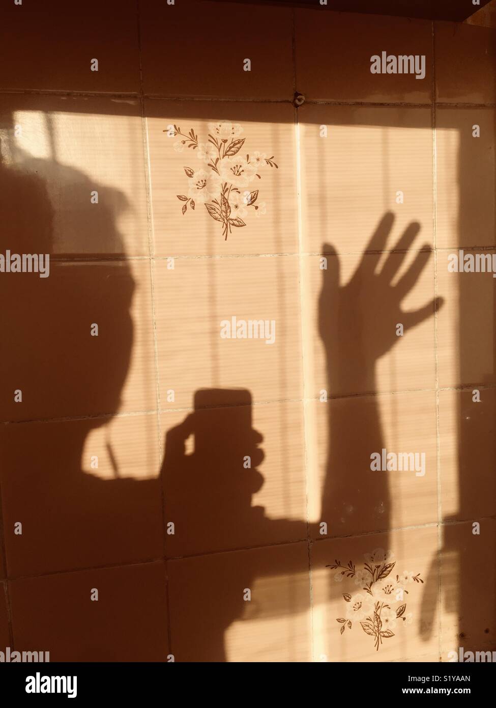 Silhouette of a man on a textured tile - Smartphone Captured Stock Image