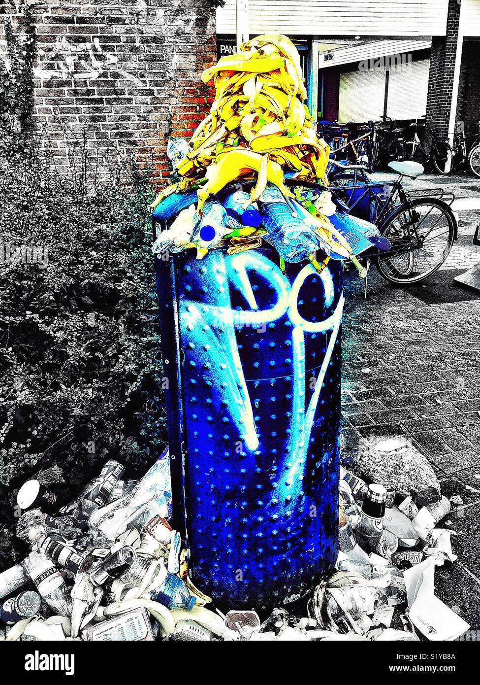 Overflowing rubbish bin, Amsterdam, Netherlands - Smartphone Captured Stock Image