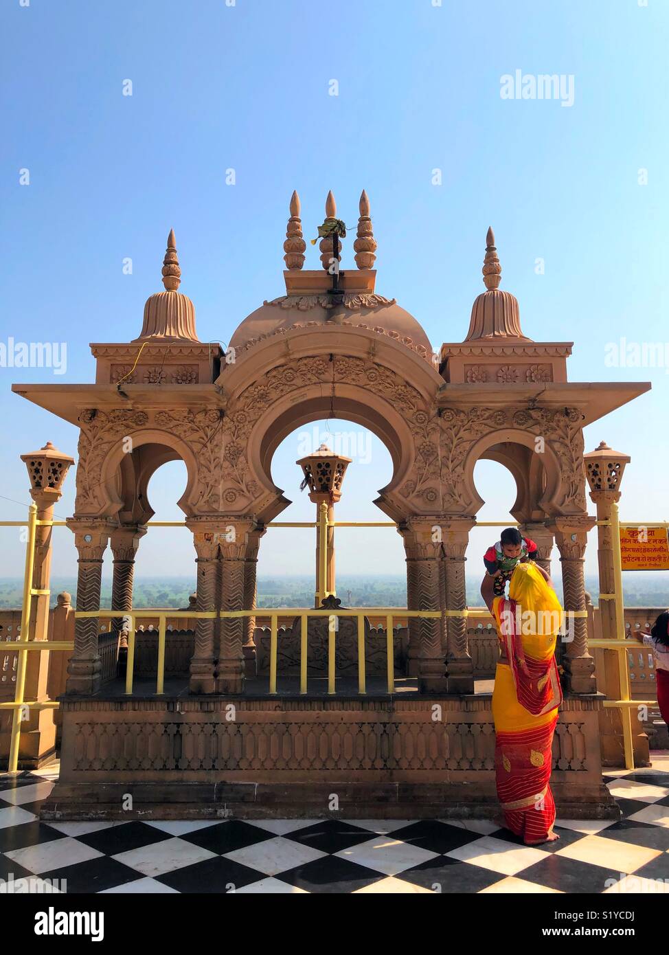 Top view of Shri Radha Rani Temple in Barsana city in Uttar Pradesh, India. Mother and child visiting temple in India. Stock Photo