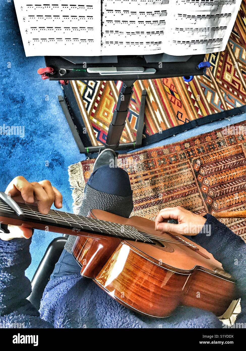 Woman playing guitar - Smartphone Captured Stock Image