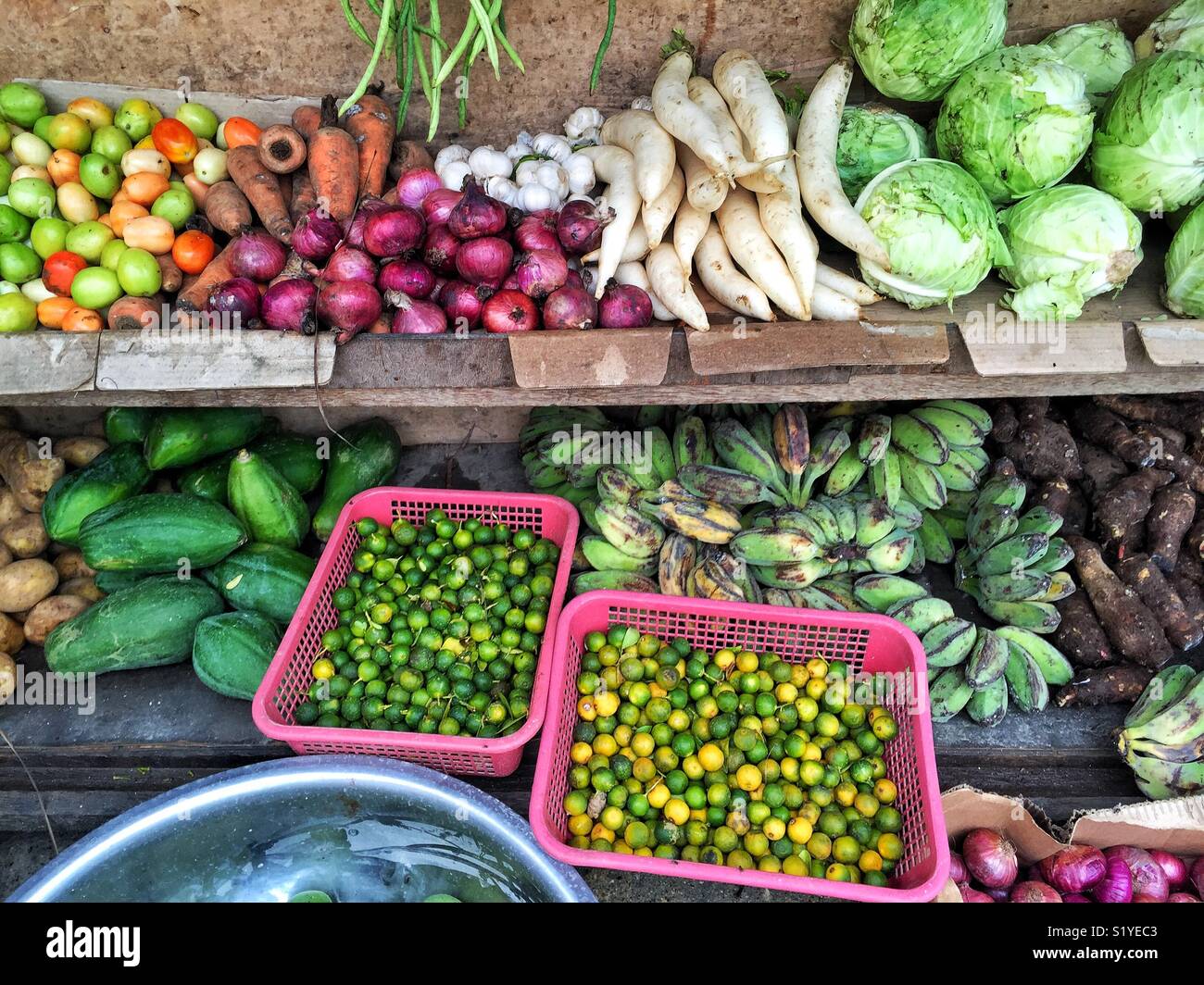 Tropical fruits and vegetables on makeshift street stand in the Philippines Stock Photo