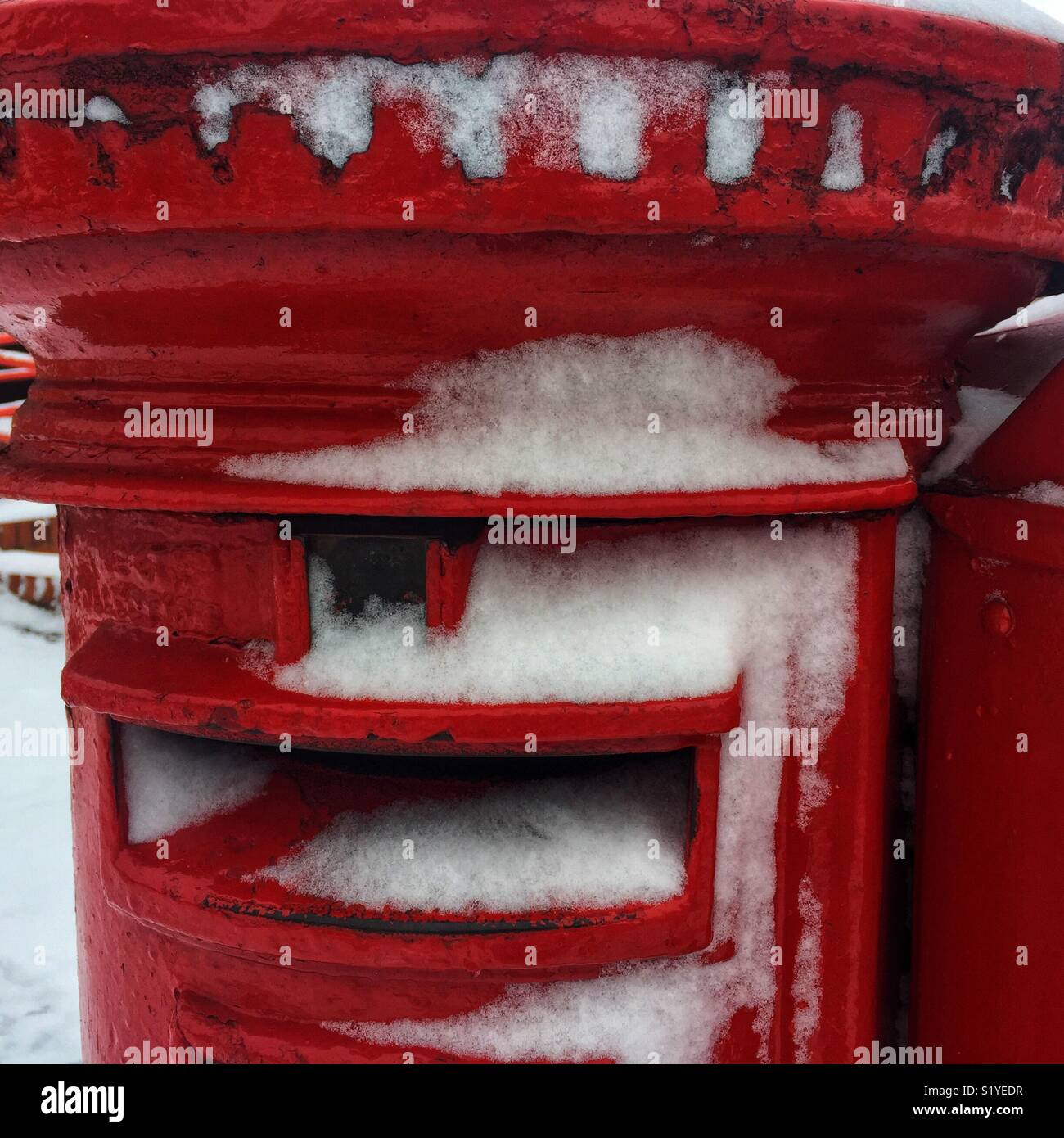 Snow-covered post box. - Smartphone Captured Stock Image