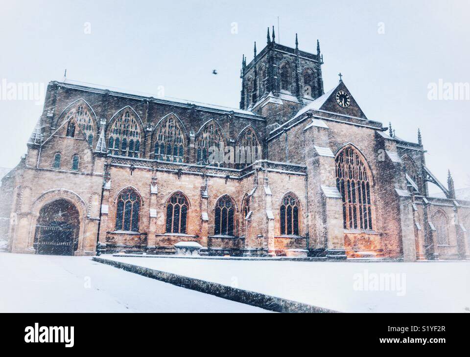 UK Weather: Sherborne, Dorset. Snow on Sherborne Abbey in the historic market town of Sherborne as the so called mini Beast from the East brings another icy blast to the South West. 18 March 2018 - Smartphone Captured Stock Image